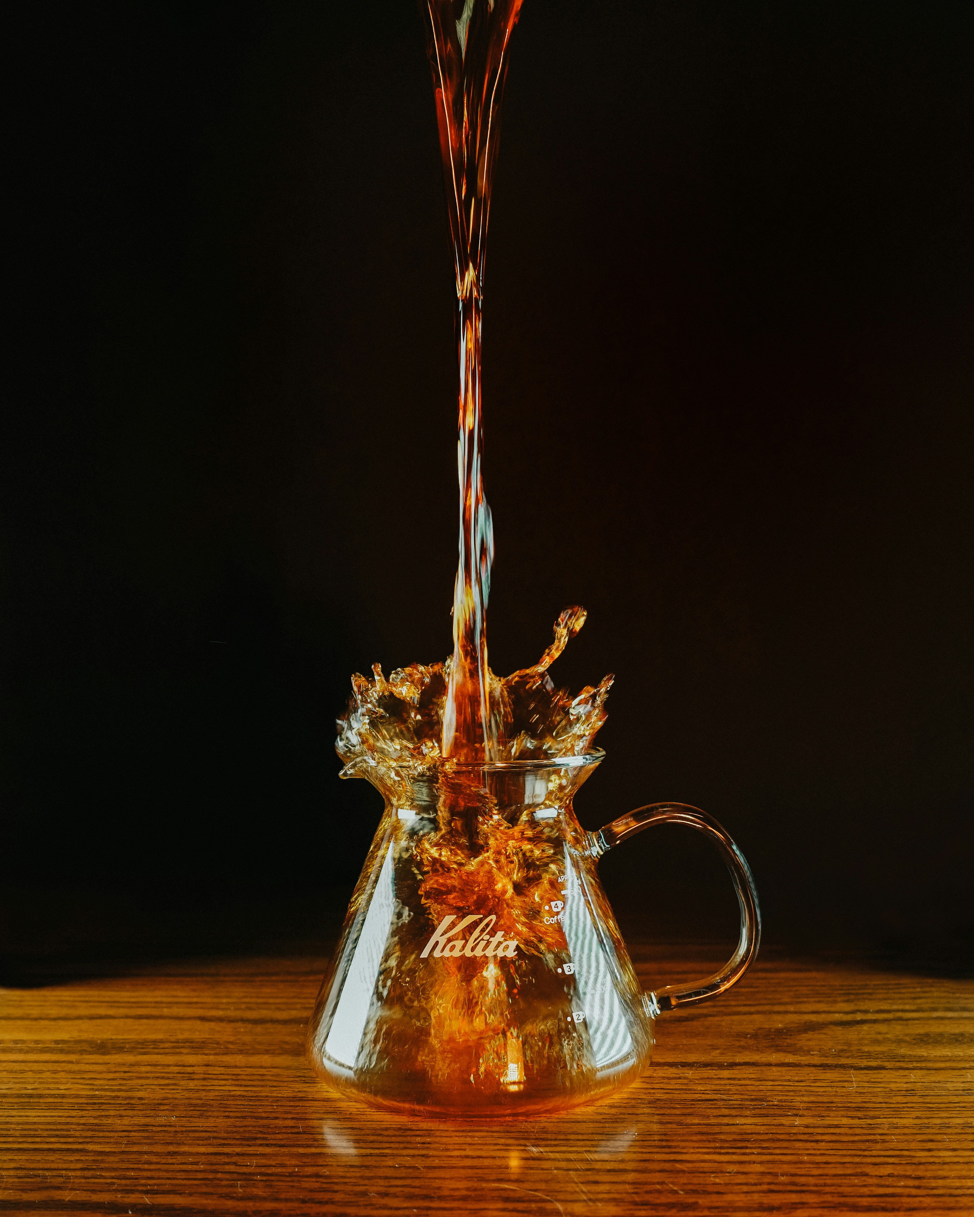 clear glass mug with red liquid