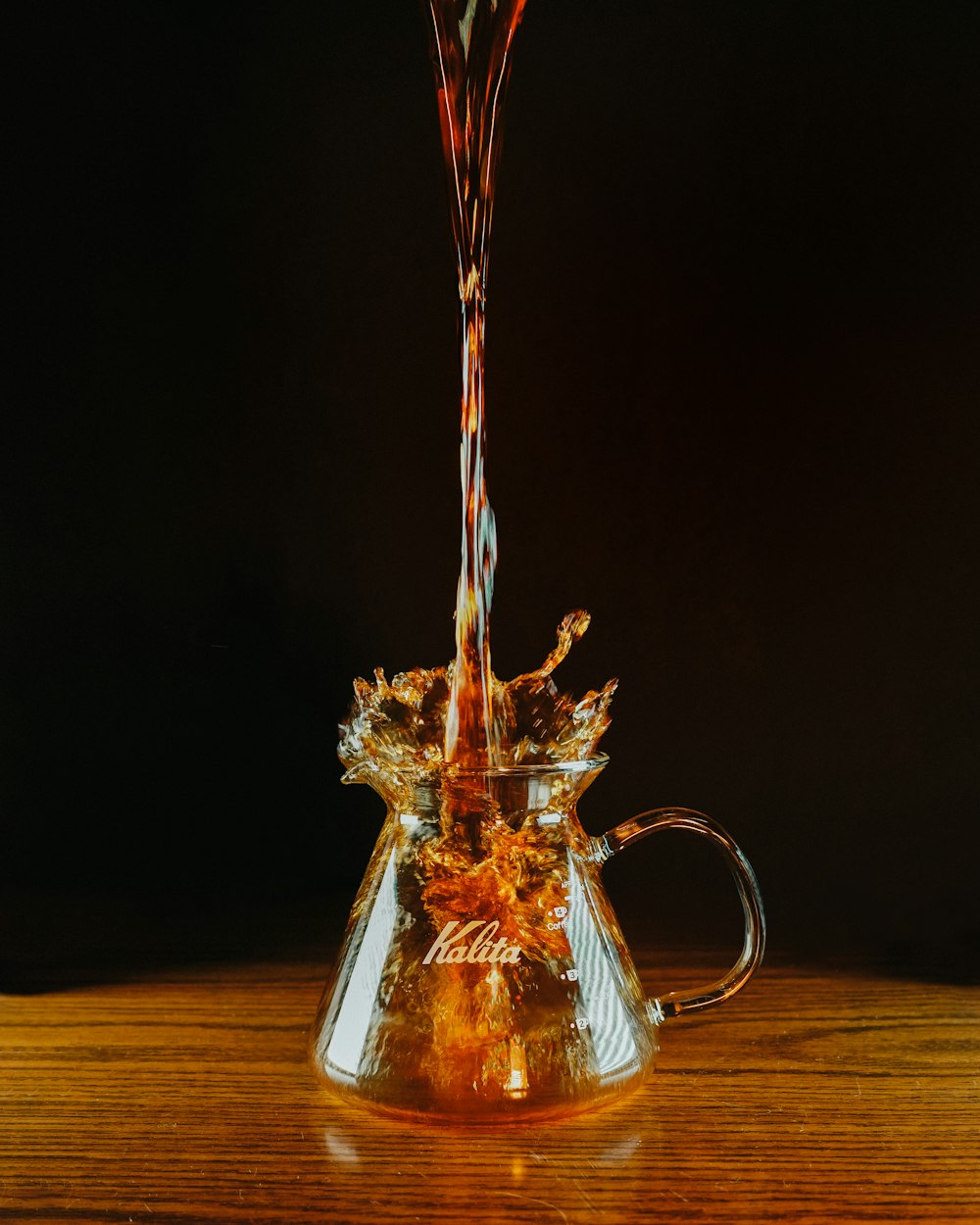 clear glass mug with red liquid