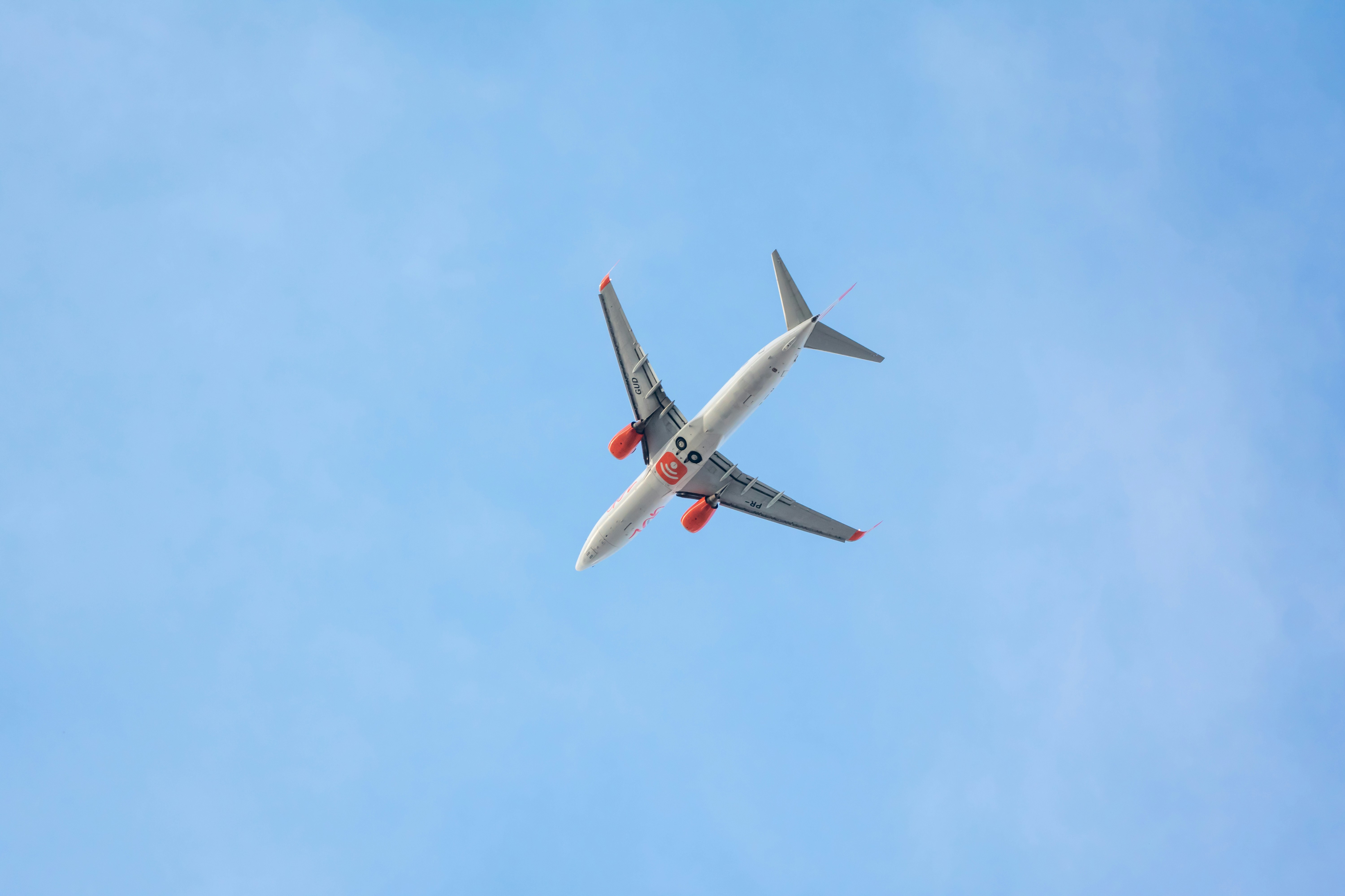 white and red airplane in the sky, 