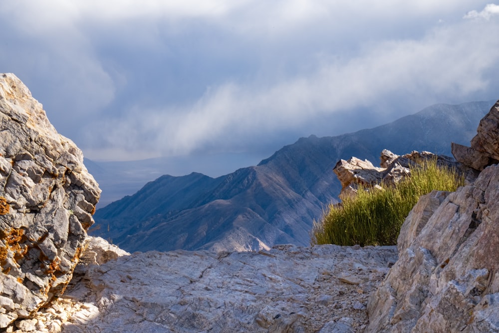 rocky mountain under cloudy sky during daytime