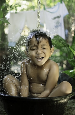 topless child with white floral headband