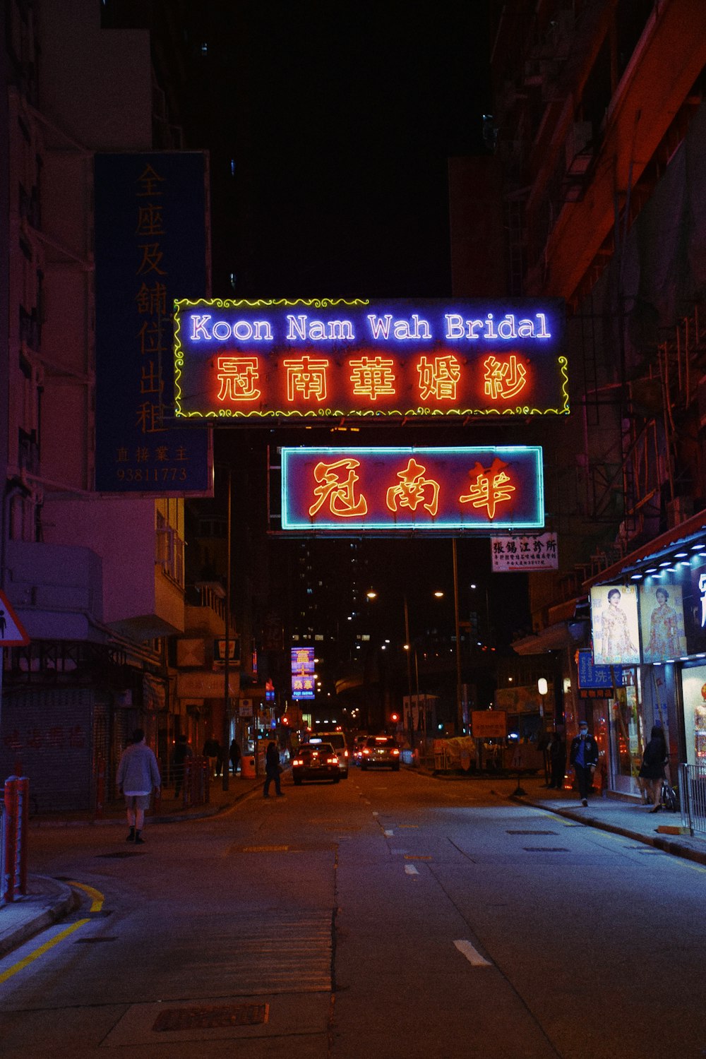 people walking on street during night time