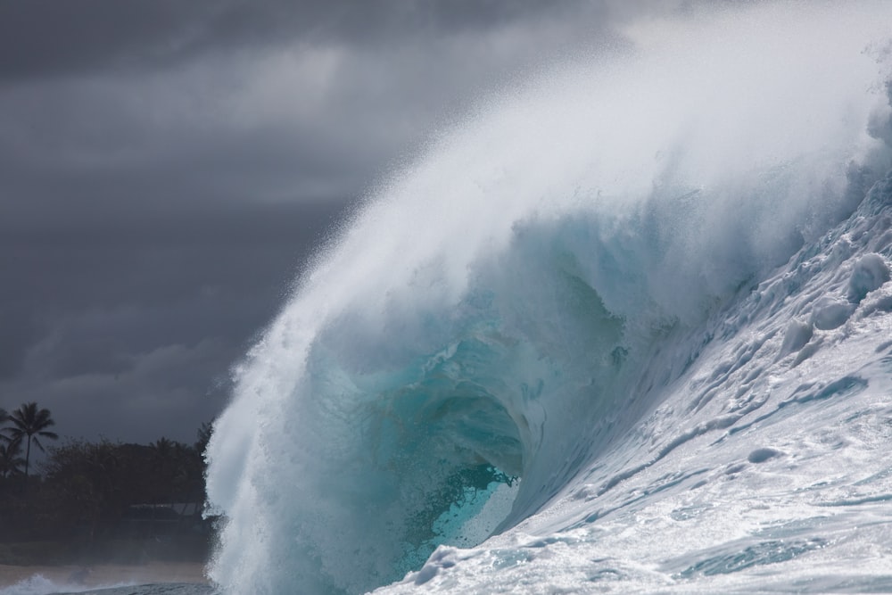 a big tsunami wave hitting the coast