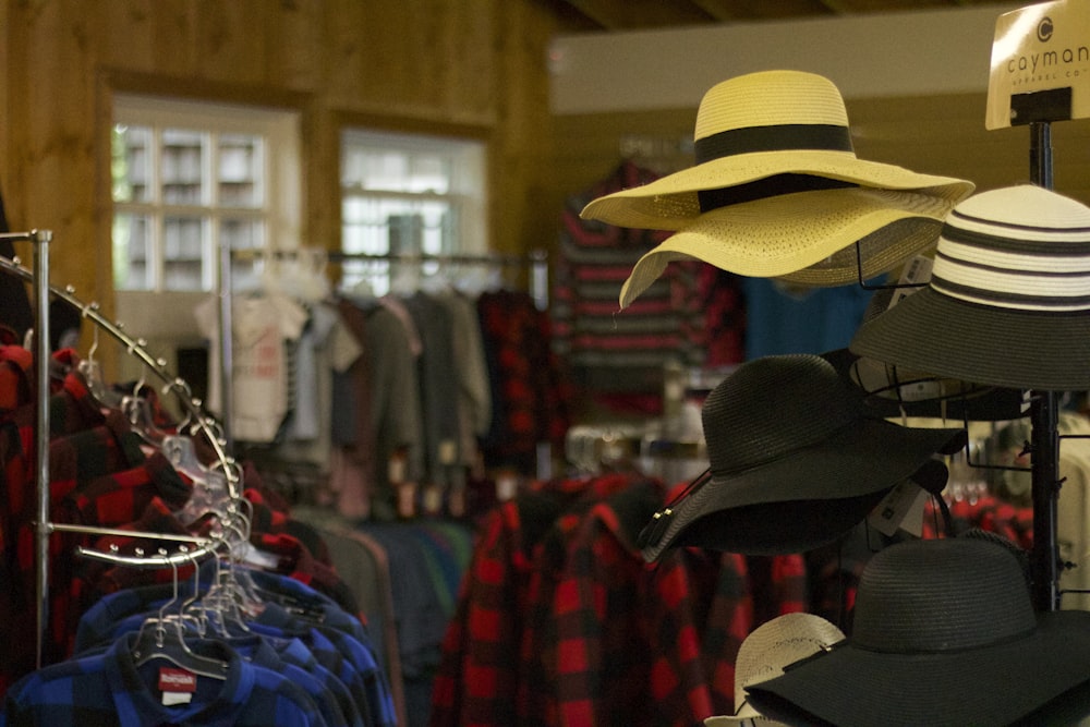 assorted clothes hanged on clothes rack