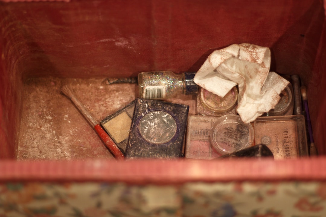 clear glass bottle on brown wooden table