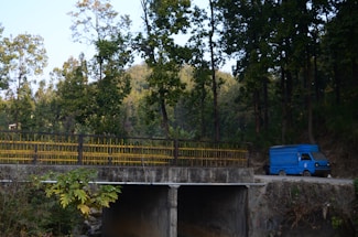 A friendly delivery truck loaded with fresh green sod rolls ready for delivery in Connecticut.
