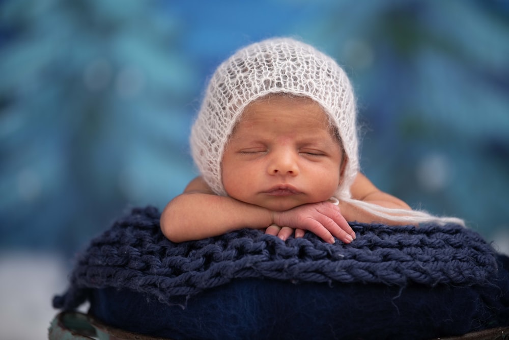 baby in white knit cap