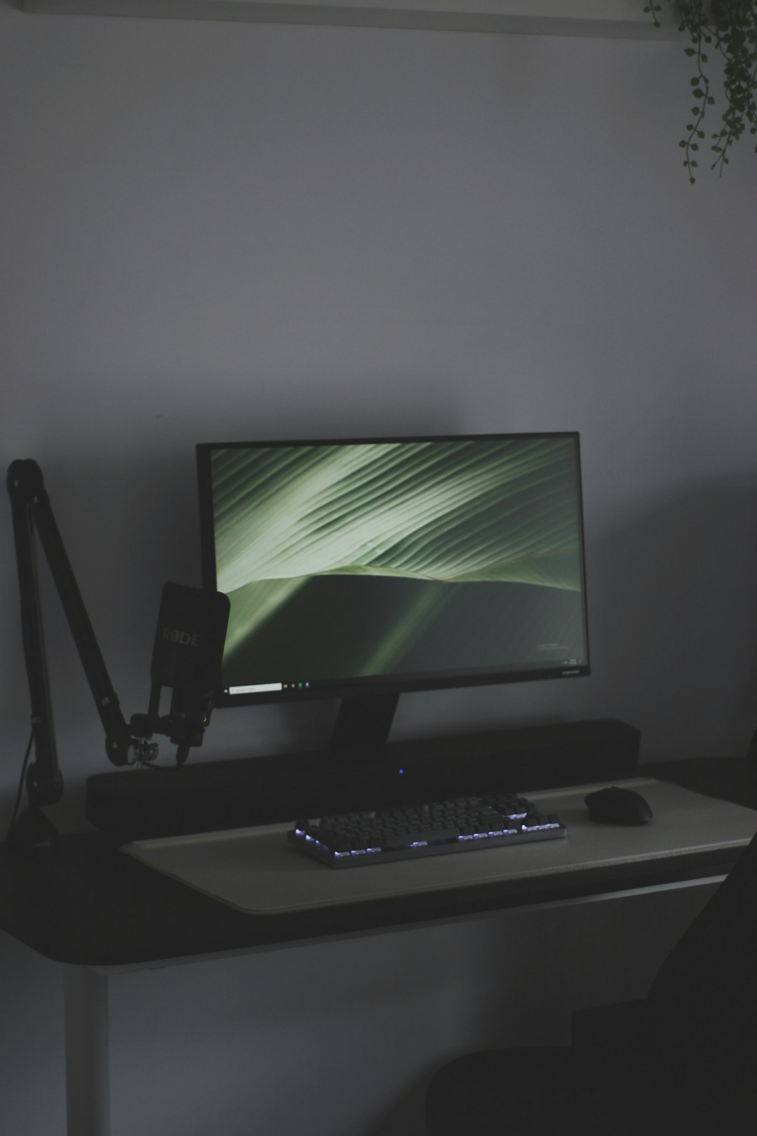 black flat screen computer monitor on white desk