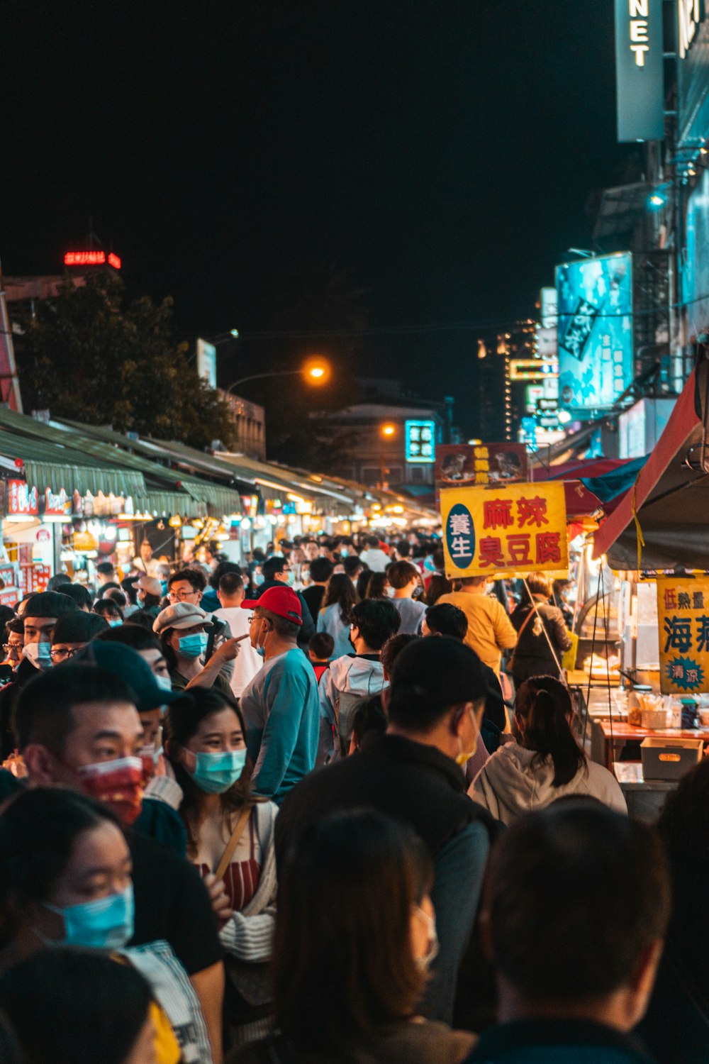 people walking on street during night time