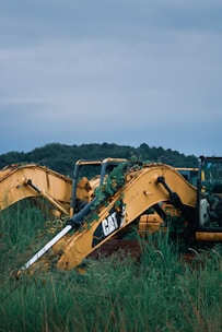 brown and black metal machine on green grass field