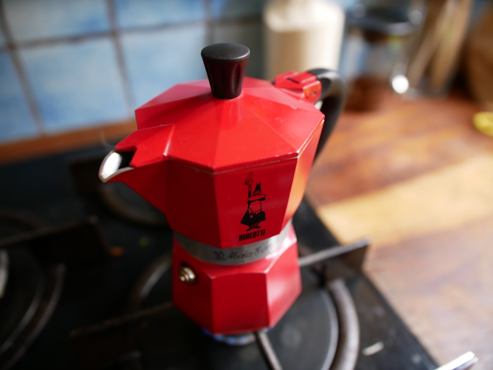 red and silver coffee maker