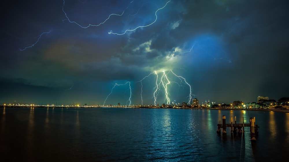 a large group of lightning strikes over a city