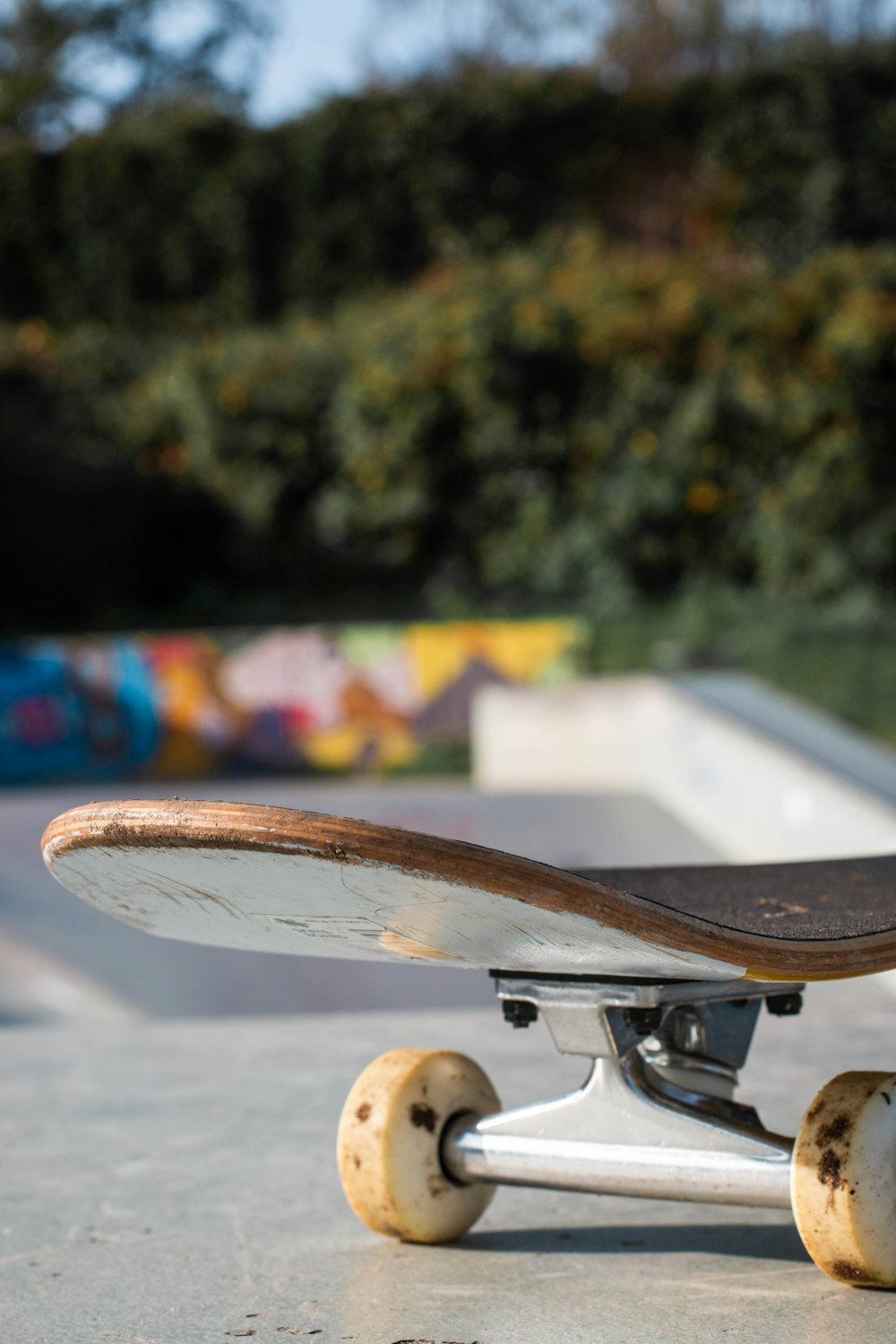 brown skateboard on gray concrete floor during daytime