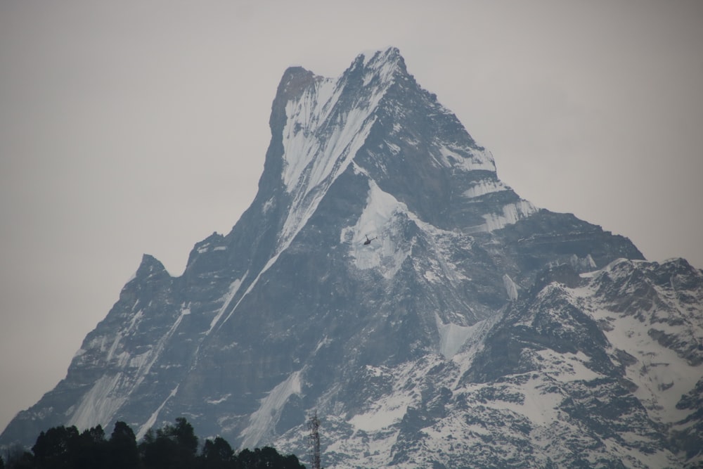 snow covered mountain during daytime