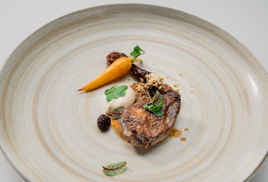 cooked food on white ceramic plate, Mozaic is A Fresh Oasis Amongst Restaurant Gastronomique in Bali