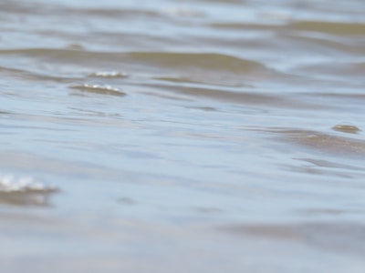 Close-up of gentle sound waves rippling over a serene crystal cluster.