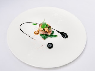 Artistic presentation of a modern grilled dish with vibrant colors on a minimalist plate.