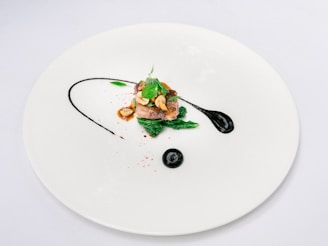 green vegetable on white ceramic plate