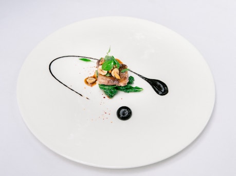 Artistic presentation of a modern grilled dish with vibrant colors on a minimalist plate.