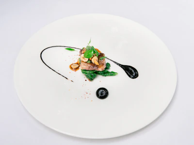 Close-up of a Scandinavian-style dish artfully plated in a minimalist restaurant environment