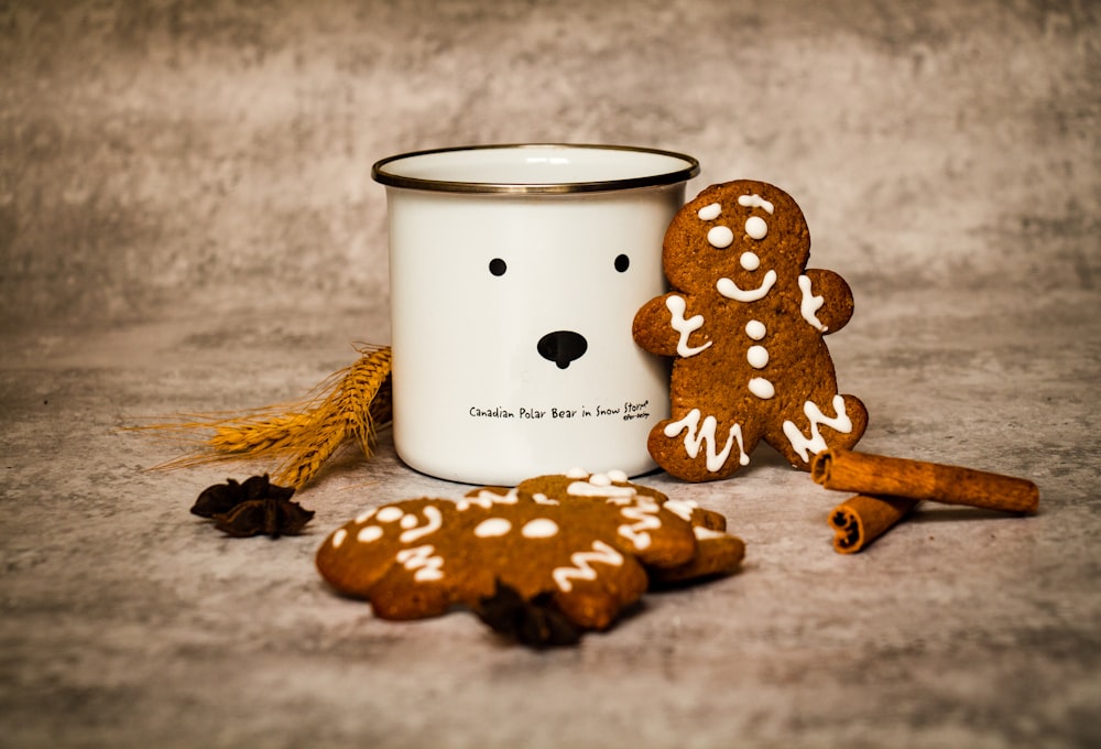 white and black polka dot ceramic mug on brown wooden table