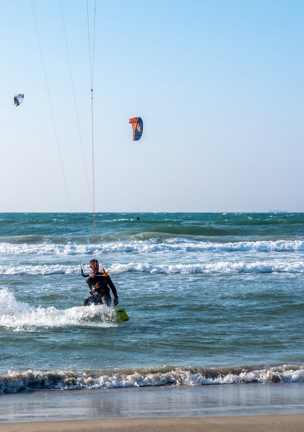 person surfing on sea waves during daytime