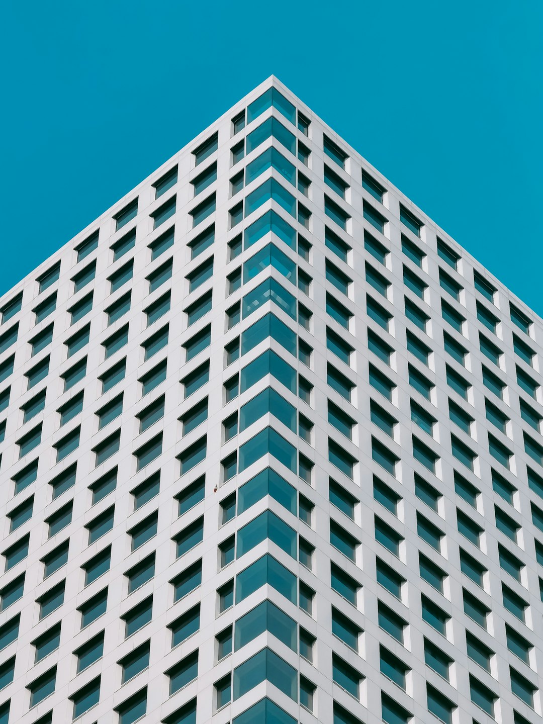 white concrete building under blue sky during daytime