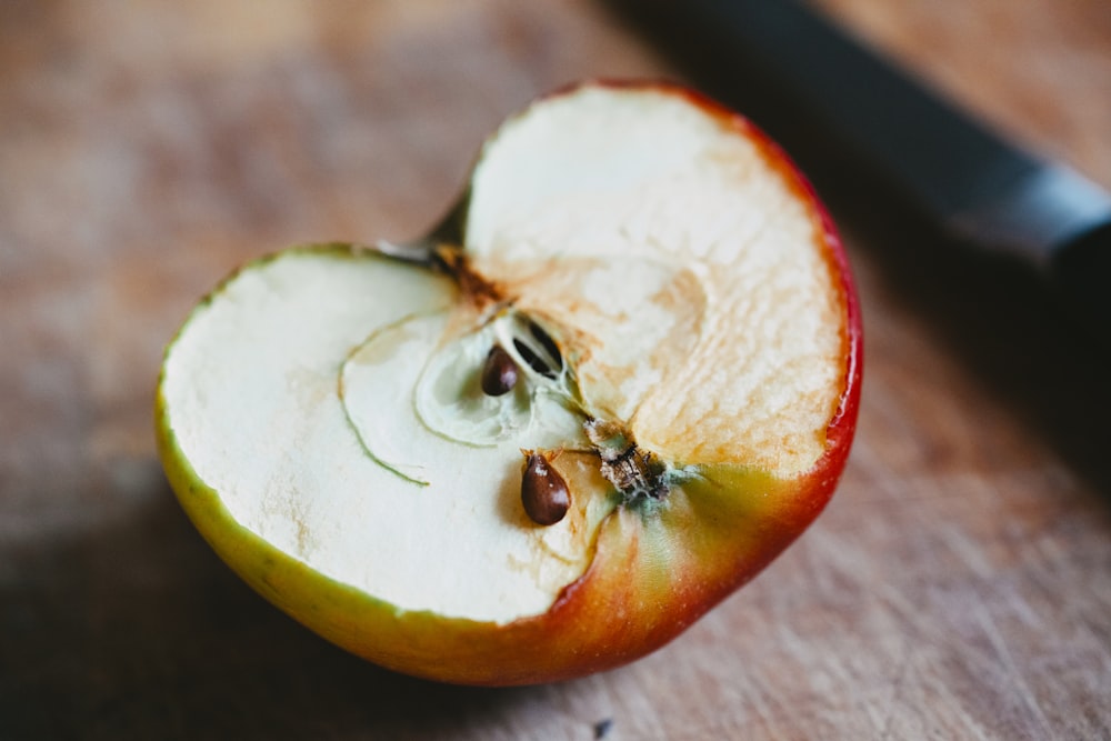 sliced orange fruit on brown wooden table