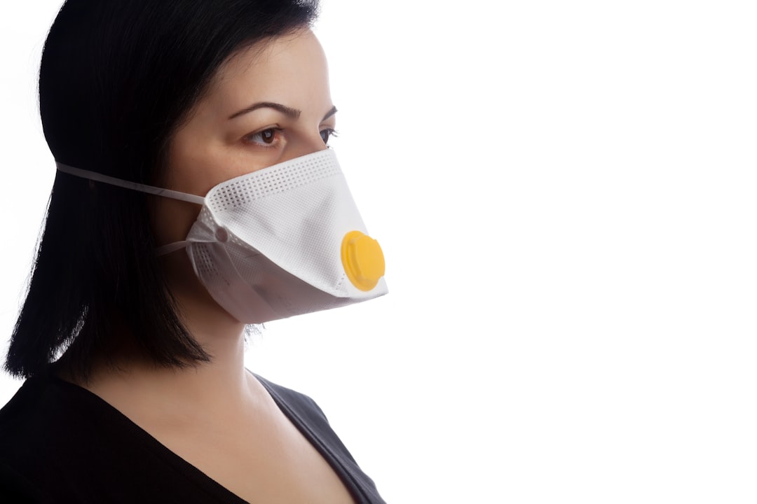 woman in white tank top wearing white mask