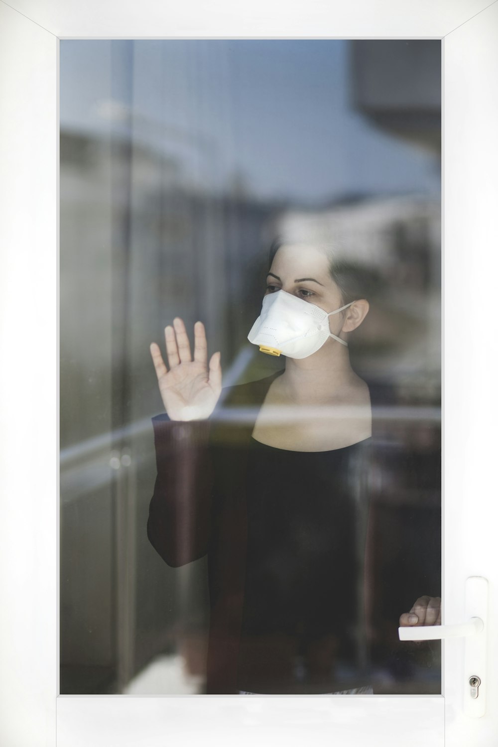 woman in white hijab holding white ceramic mug