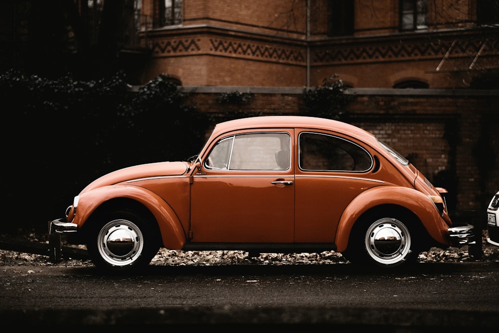 red vintage car on road