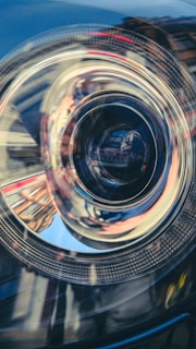 Macro image showing the intricate wiring of a car's headlight assembly.