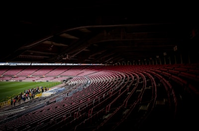 Behind-the-scenes tour of a famous stadium with fans exploring locker rooms.