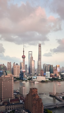 city skyline under cloudy sky during daytime