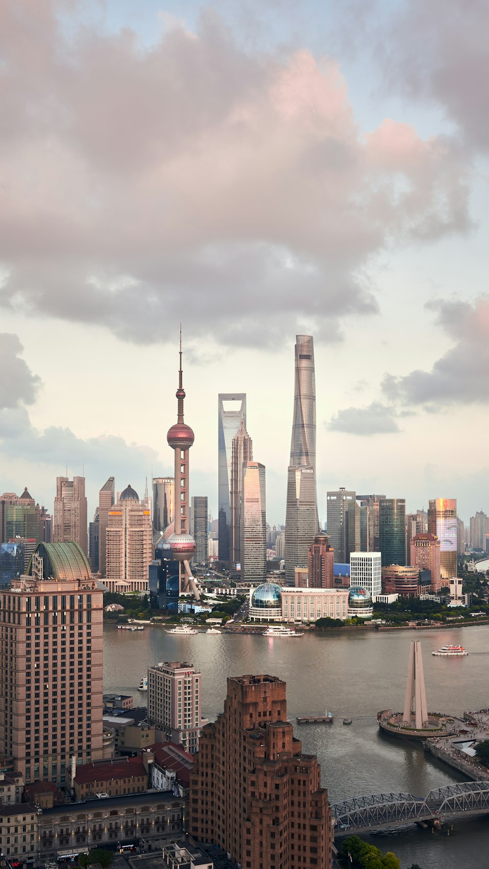 city skyline under cloudy sky during daytime