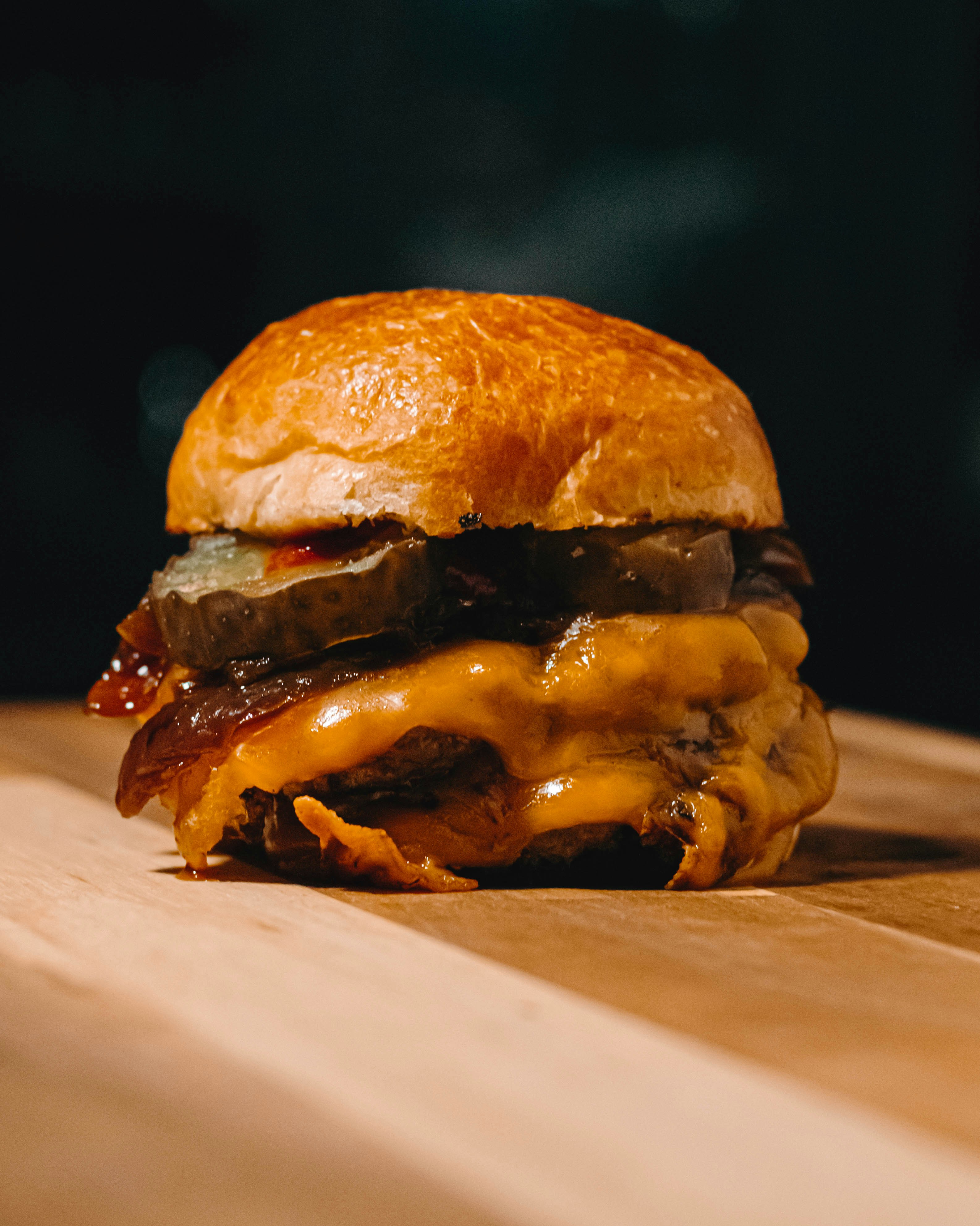 burger on white and brown textile