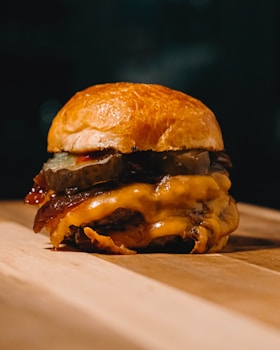 burger on white and brown textile