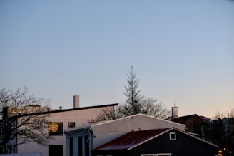 A serene urban rooftop view at dusk with subtle lighting and clean lines.