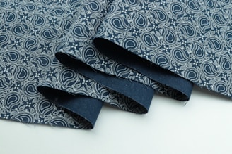 blue and white floral textile
