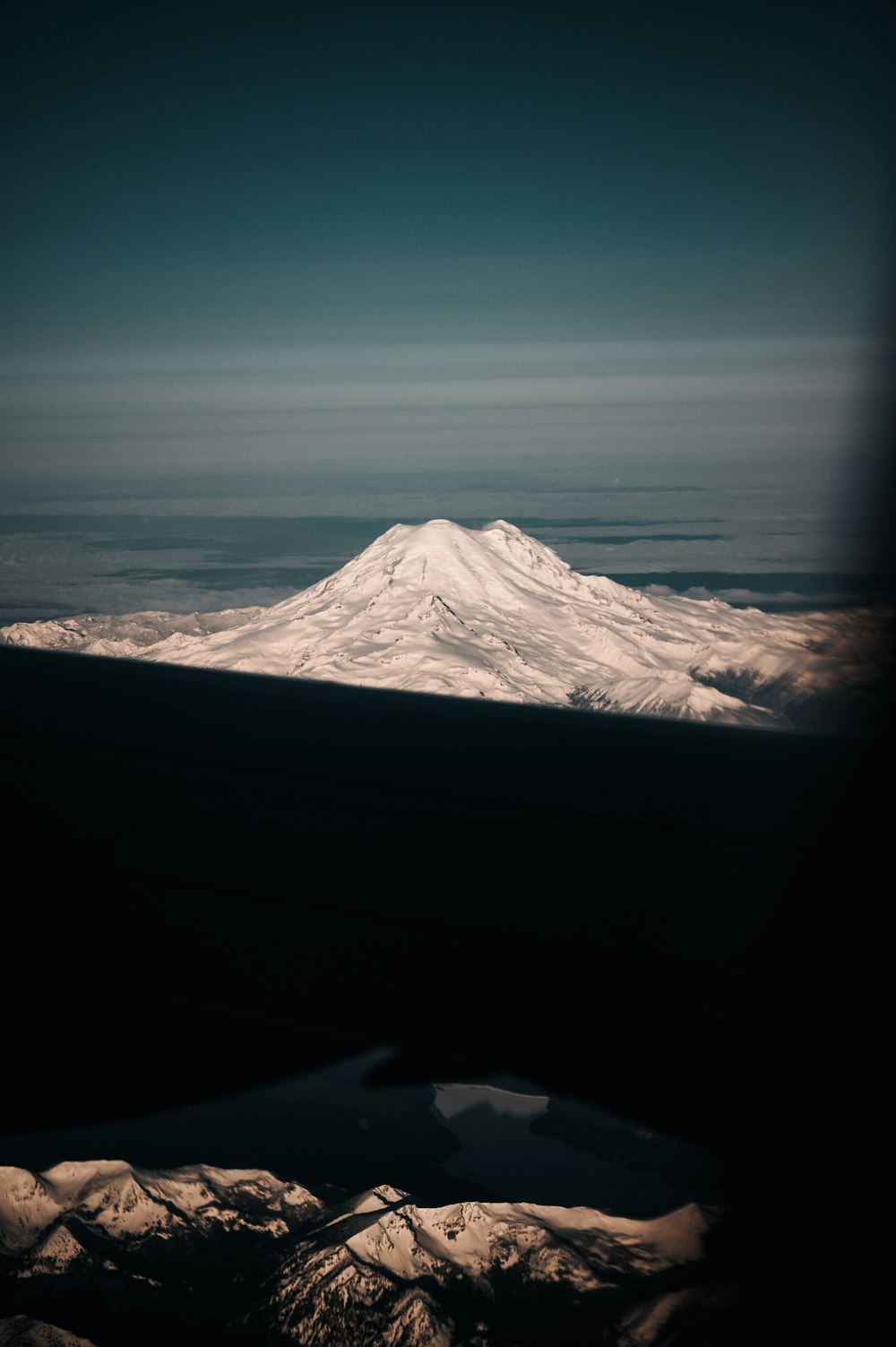 snow covered mountain during daytime