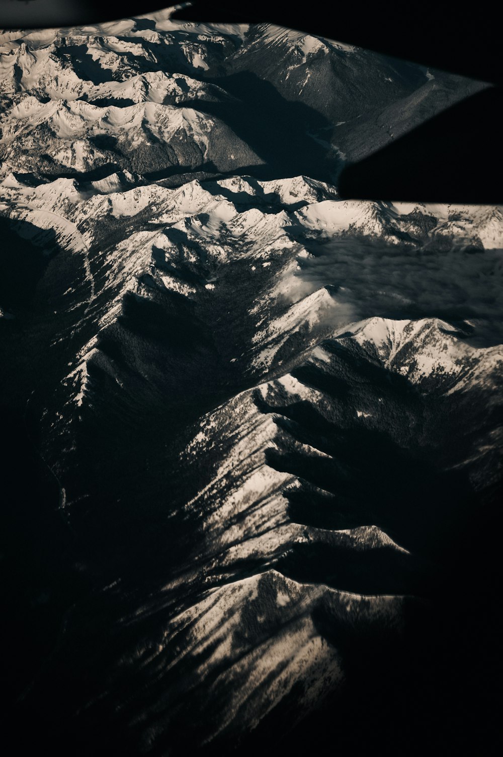 grayscale photo of snow covered mountain