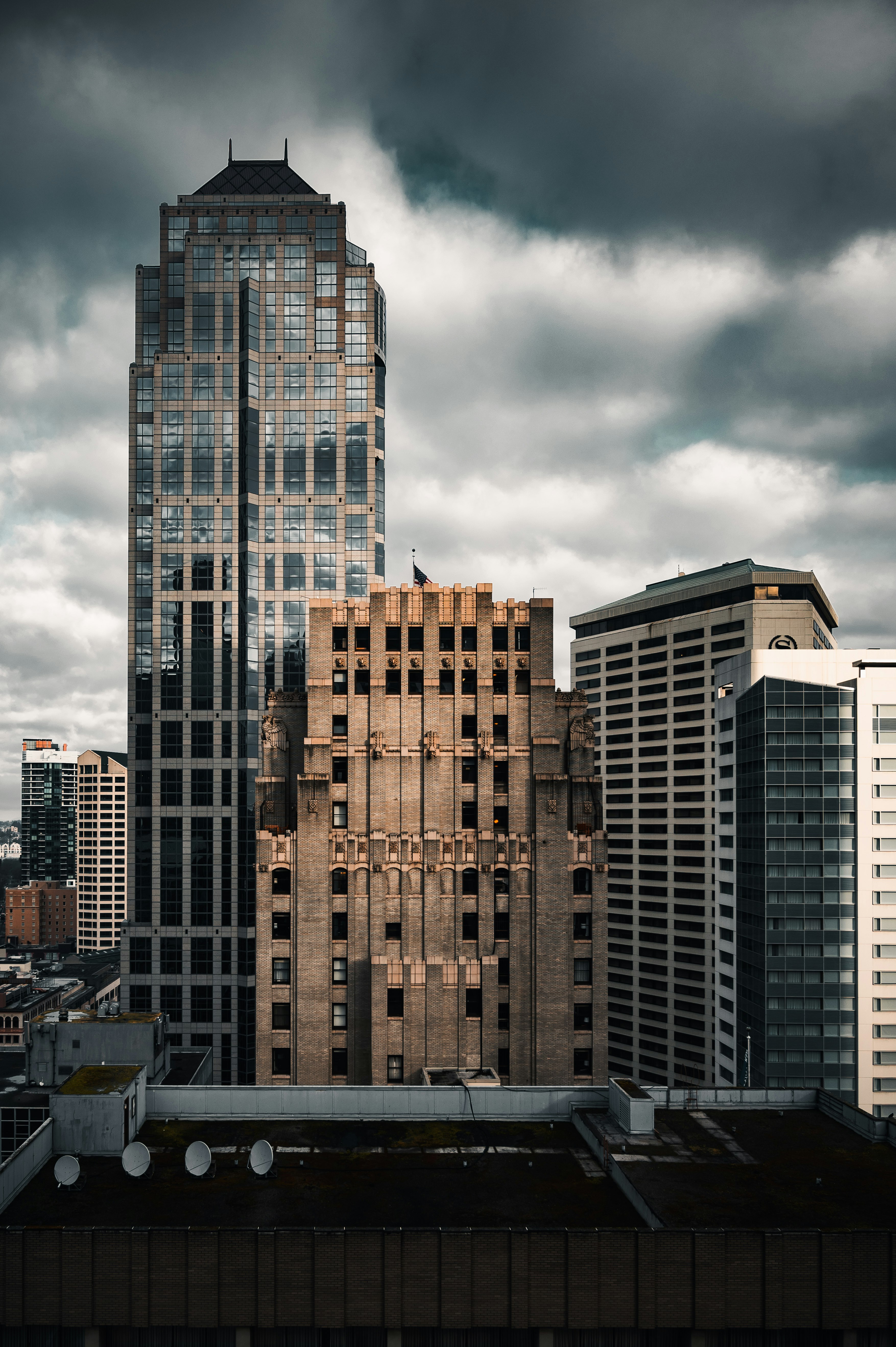 brown and black concrete building under gray clouds during daytime