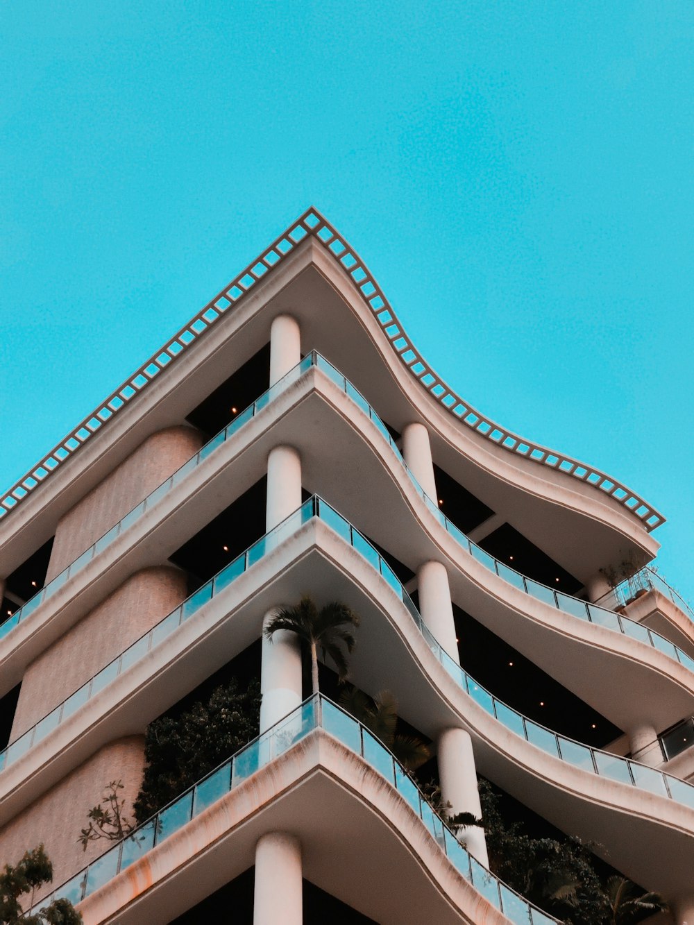 brown and white concrete building under blue sky during daytime