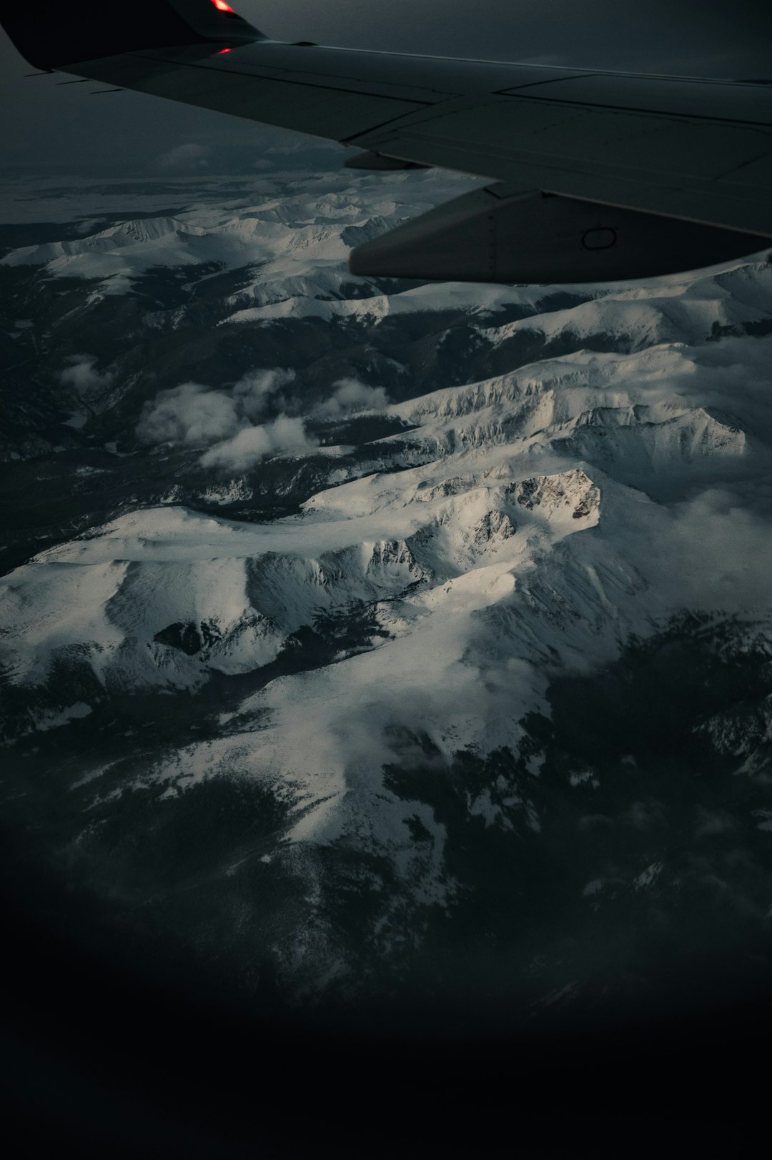 aerial view of snow covered mountains during daytime