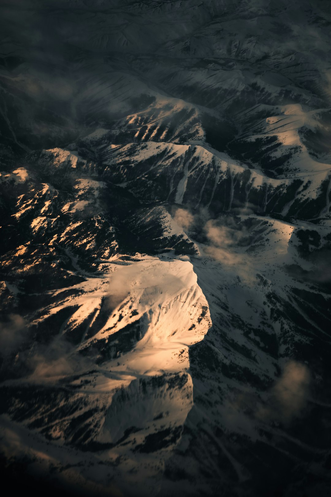 snow covered mountain during daytime