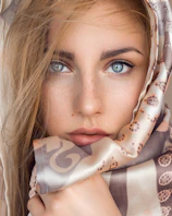 woman with brown and white floral scarf