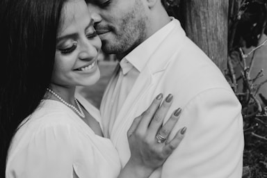 the ring,how to photograph man in white dress shirt kissing womans cheek