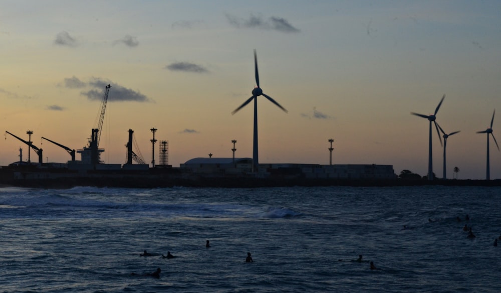 wind turbines on dock during daytime