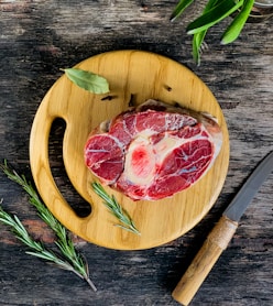 sliced pizza on brown wooden round plate
