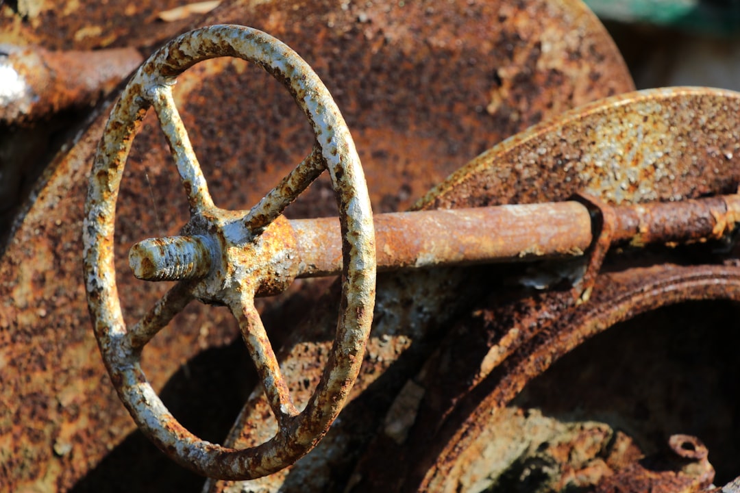 brown metal wheel on brown soil